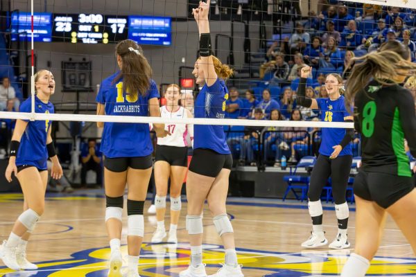 Rylee Martin (from left), Alyssa Groves, Joslyn Richardson, Madison Burr and Katie Van Egdom come together to celebrate a point during a 3-0 win over North Dakota on Saturday, Oct. 12 at First Bank & Trust Arena in Brookings.