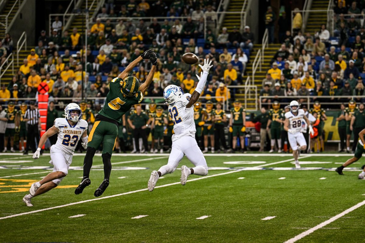 South Dakota State's Colby Humphrey (22) defends a pass intended for North Dakota State's Bryce Lance (5) during the Dakota Marker game at the FARGODOME in Fargo on Saturday, Oct. 19, 2024.