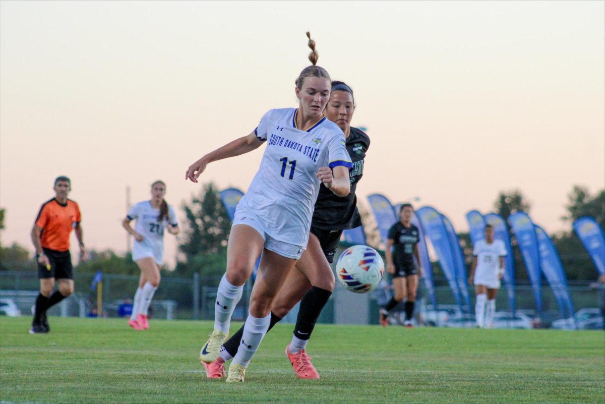 Hailee Christensen running the ball up the pitch in search of a goal. Christensen is a freshman from Sioux Falls, S.D.