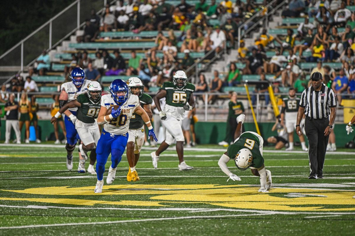 Kirby Vorhees rushes the ball passed Southeastern Louisiana defenders in their 41-0 blowout on Sept. 21. In this game, Vorhees, a redshirt freshman rushed the ball five times for a total of 179 yards and three touchdowns. Vorhees longest run of the game was 80 yards.
