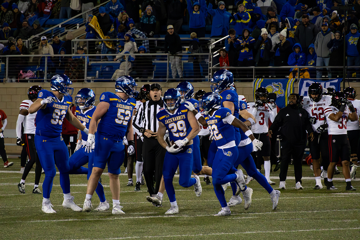 SDSU's defense celebrates with Graham Spalding after he intercepted a pass from running back Travis Theis intended for quarterback Aiden Bouman in the fourth quarter of South Dakota State's 20-17 victory over South Dakota. 