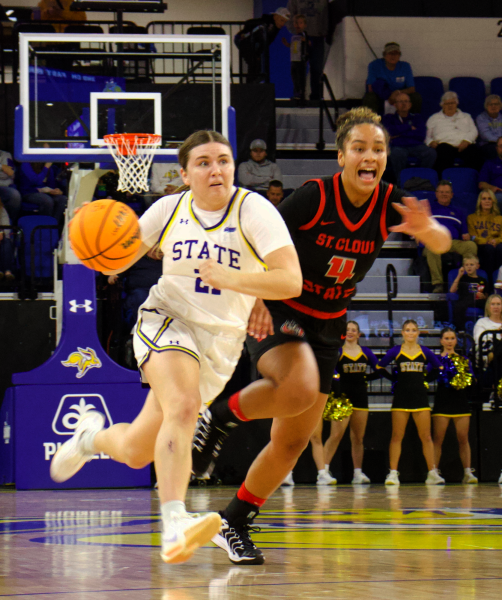 SDSU's Paige Meyer pushes passed a defender in their win over St. Cloud State.