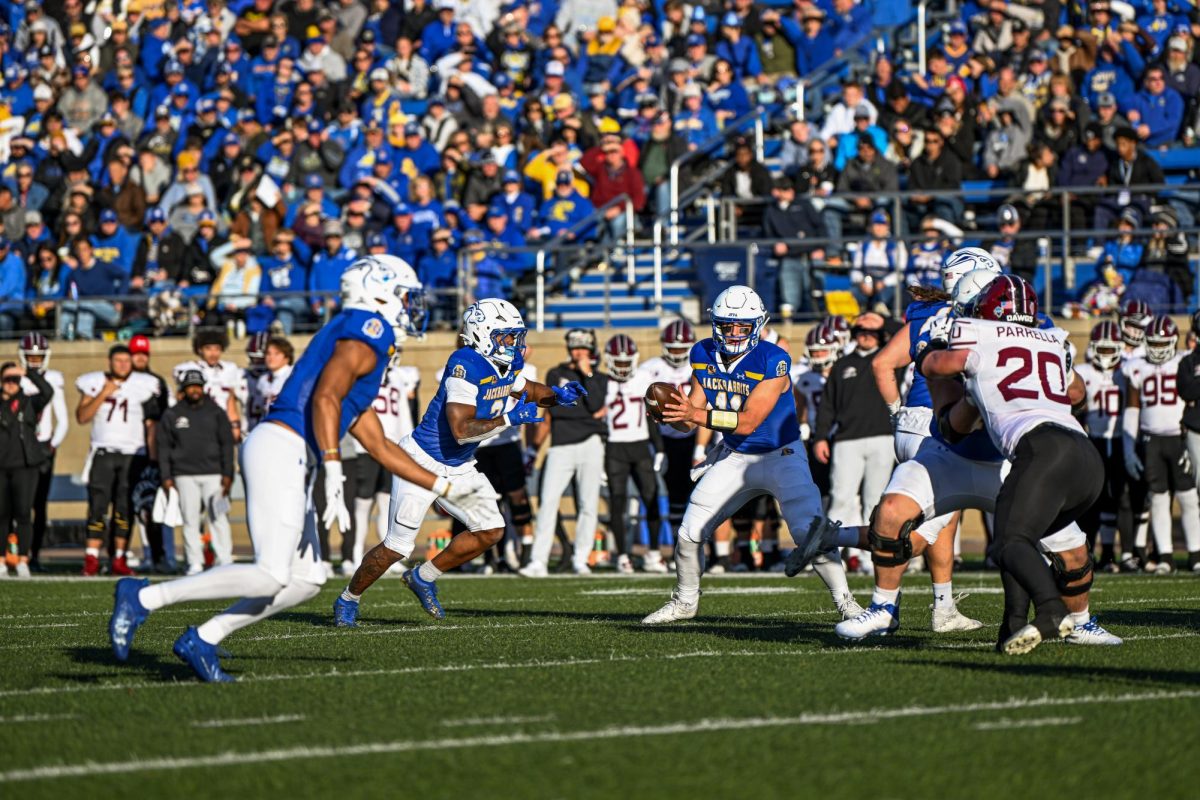 Mark Gronowski hands the ball off to Amar Johnson in SDSU's home victory over Southern Illinois.