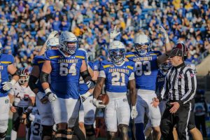South Dakota State's Angel Johnson (21) celebrates a touchdown during a 41-10 win over Southern Illinois on Nov. 16, 2024.