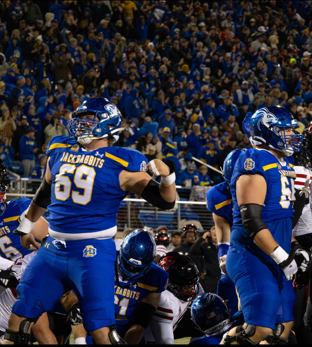 Quinten Christensen celebrates after a play in SDSU's overtime win against USD on Oct. 26.