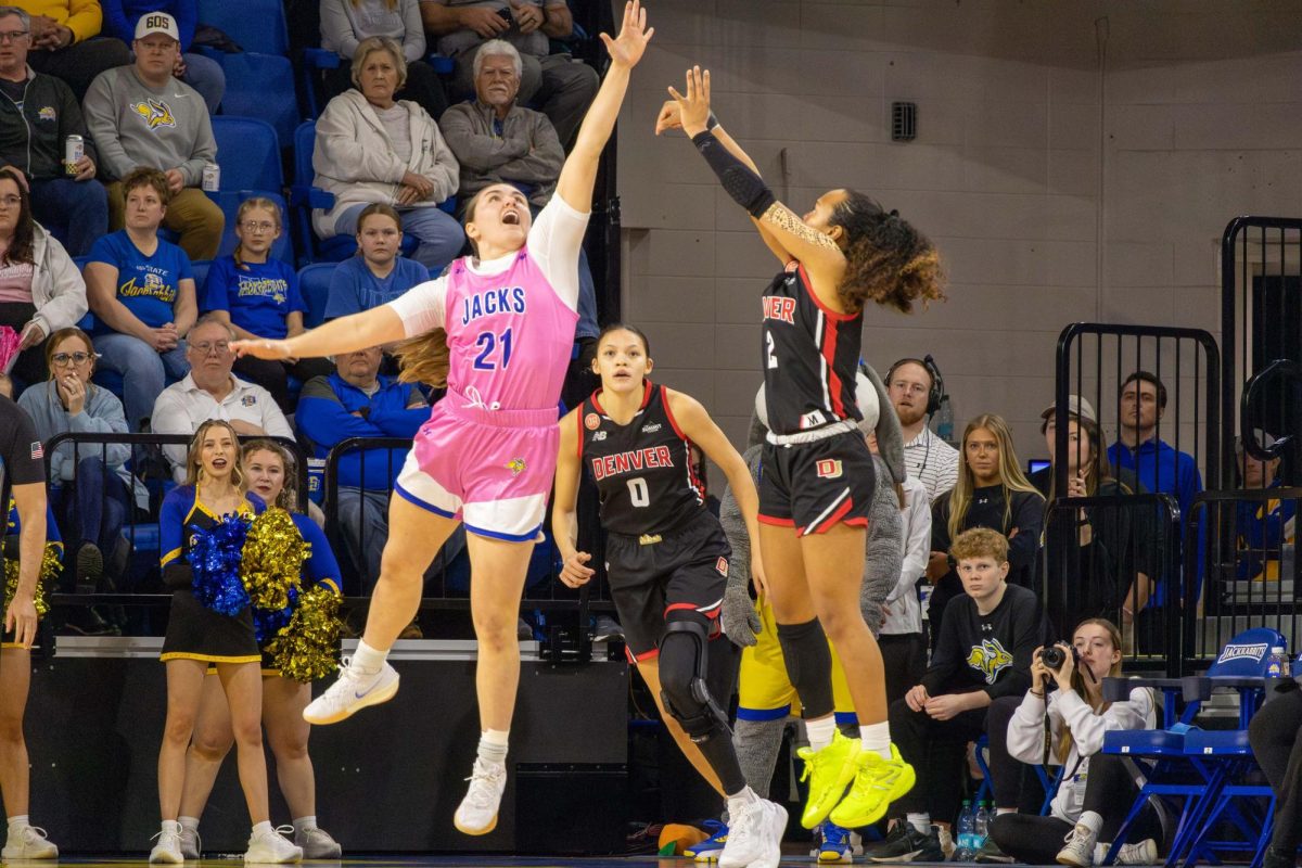 Paige Meyer contests a shot from Denver’s Angelica Robles. Meyer put up eight points, two rebounds and lead the team with 4 assists in the Jackrabbits 71-37 win against Denver.