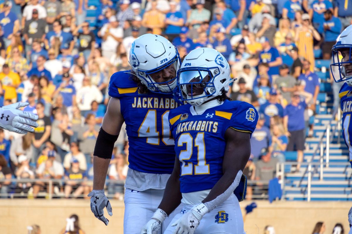 Angel Johnson and Aaron Kusler celebrating after a big play in their win against Incarnate Word 45-28 on Sept. 7 2024. SDSU beat Incarnate Word twice in the 2024 season.