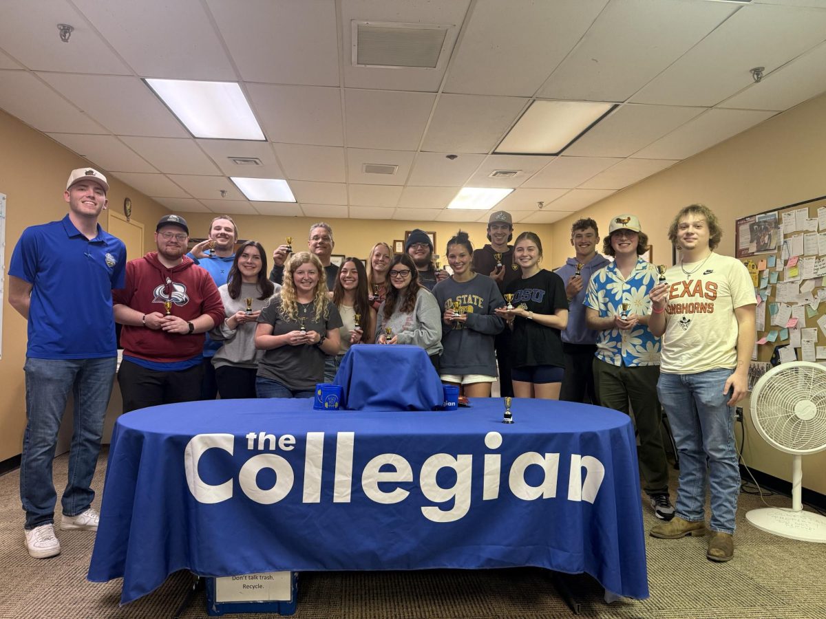 The staff of The Collegian pose for a group photo showing off their “Marshy” awards following a meeting on Monday, April 28, 2025. The “Marshy” awards were sponsored by Sports Editor Marshall Minihan and the Collegian sports department. 