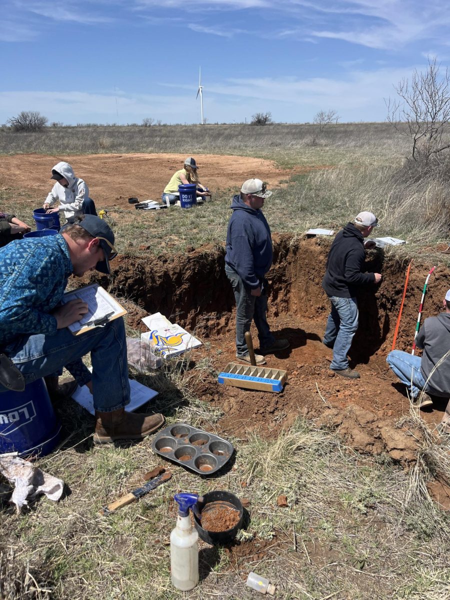 SDSU’s soil judging team practices judging a soil pit in Texas.