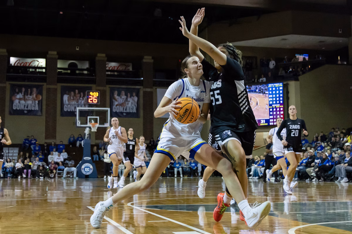 South Dakota State guard Katie Vasecka (23) drives toward the basket while Gonzaga's Zeryhia Aokuso (55) defends during a college basketball game on Thursday, Nov. 20, 2025, at the Sanford Pentagon in Sioux Falls.
