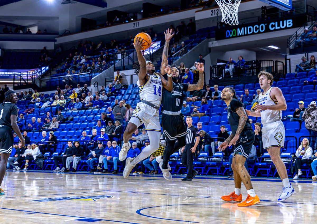 Sophomore Jaden Jackson fights his way to the basket during a basketball game against Peru State on Nov. 17, 2025. Jackson had seven points in 3-7 shooting in the 94-46 win.