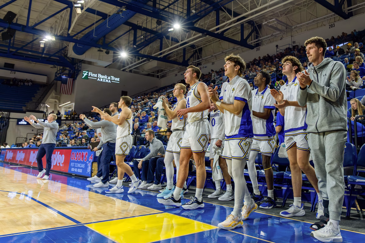 The South Dakota State basketball teams celebrates following a score against Peru State during a college basketball game on Monday, Nov. 17, 2025, at First Bank & Trust Arena in Brookings,.