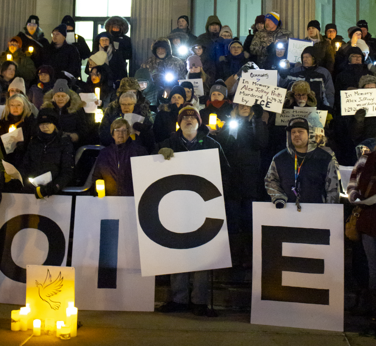 Brookings Community members hold up signs spelling “NO ICE” at the anti-ICE protest and remembrance of Alex Pretti and Rene Good in Brookings on Jan. 27.