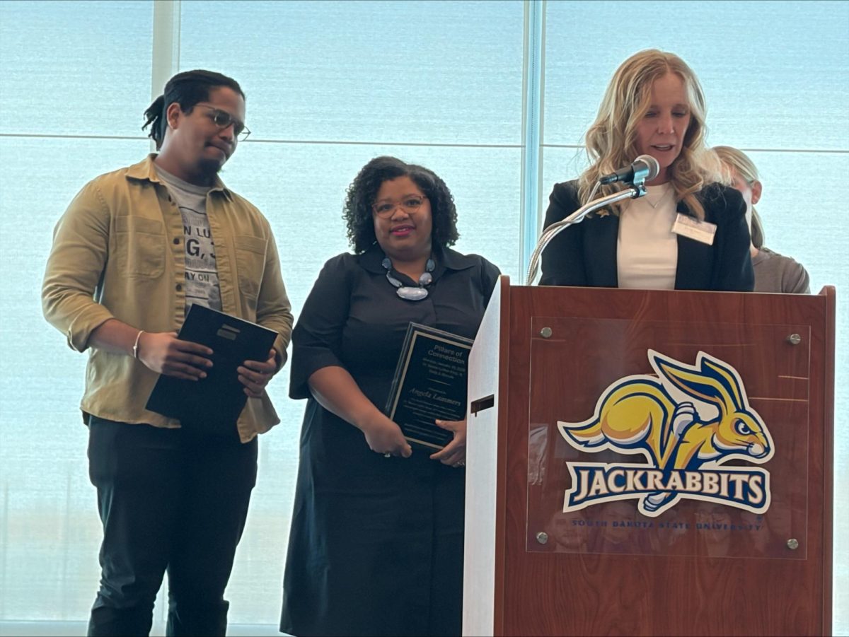 Shelly Bayer, senior director of student engagement, addresses the crowd at the fourth annual Martin Luther King, Jr. Rally and Marade on Monday, Jan. 19, 2026, at Club 71 in Dana J. Dykhouse Stadium. 