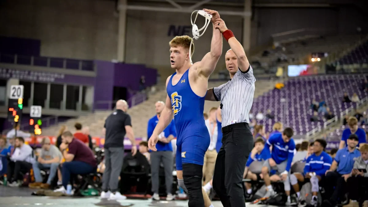 Bennet Berge celebrates after pinning Utah Valley’s Kael Bennie in a wrestling match Jan. 16, 2026. Berge is ranked No. 7 in the country, weighing in at 197 pounds. The pin against Bennie was his first of the season. 