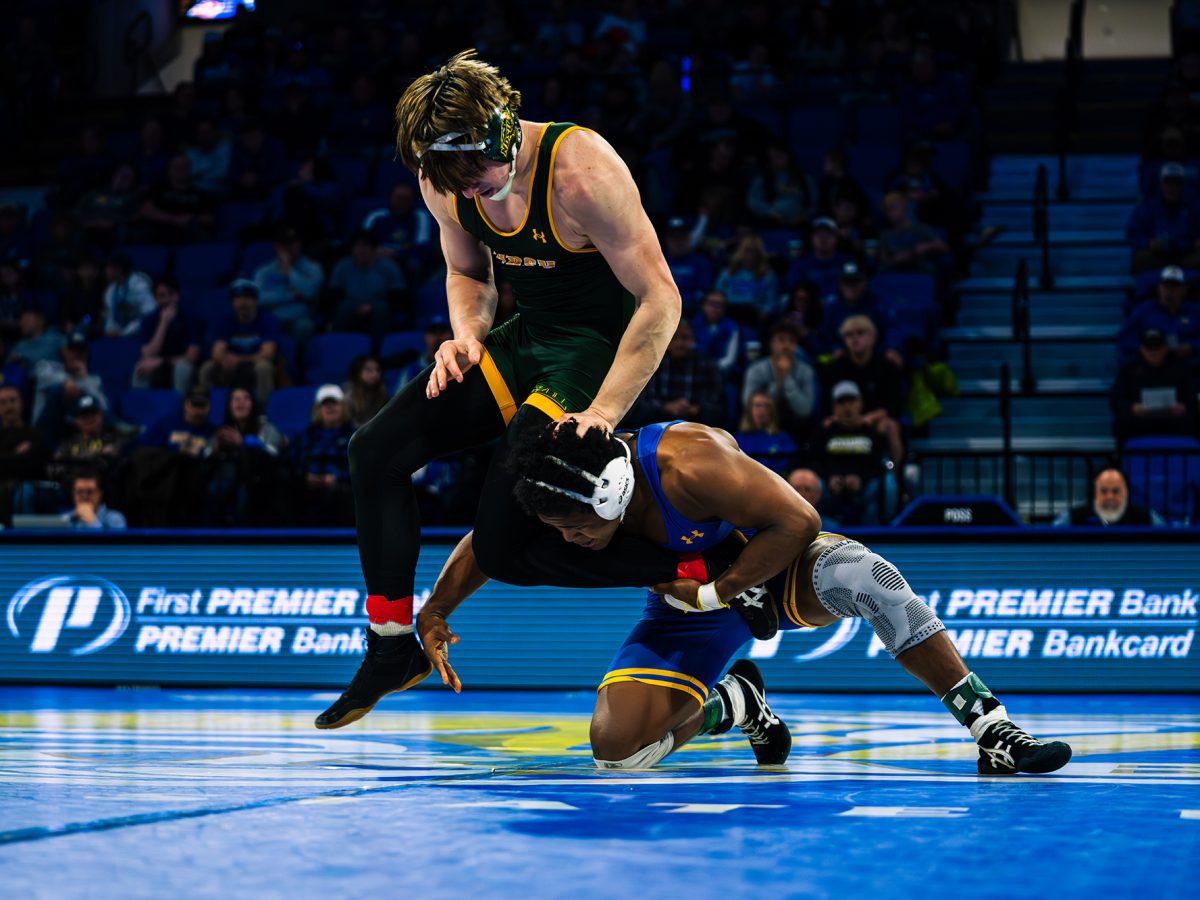 South Dakota State’s Moses Espinoza-Owens wrestles Max Magayna at First Bank and Trust Arena on Sunday, Feb. 22, 2026. Espinoza-Owens came out with the victory but the Jacks as a team took a 20-13 loss.