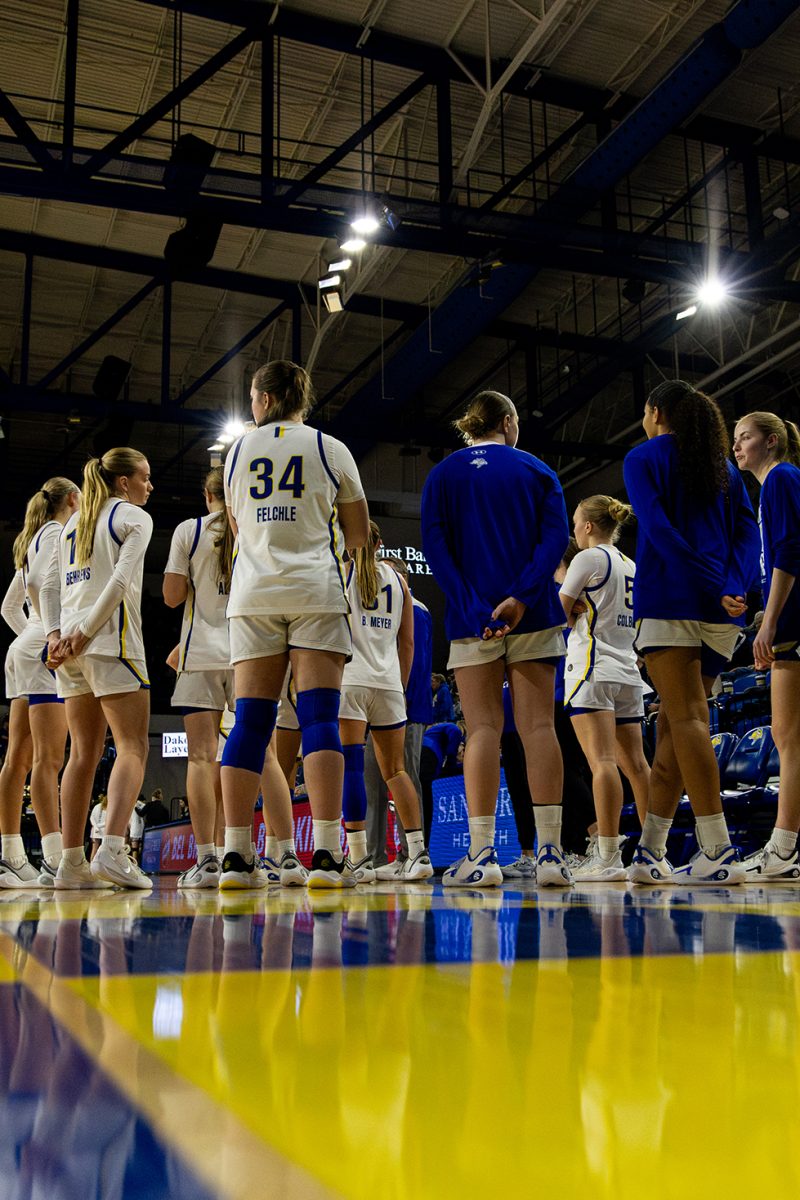 South Dakota State women’s basketball team huddles up at First Bank & Trust Arena during a game against the Omaha Mavericks on Jan. 28. 