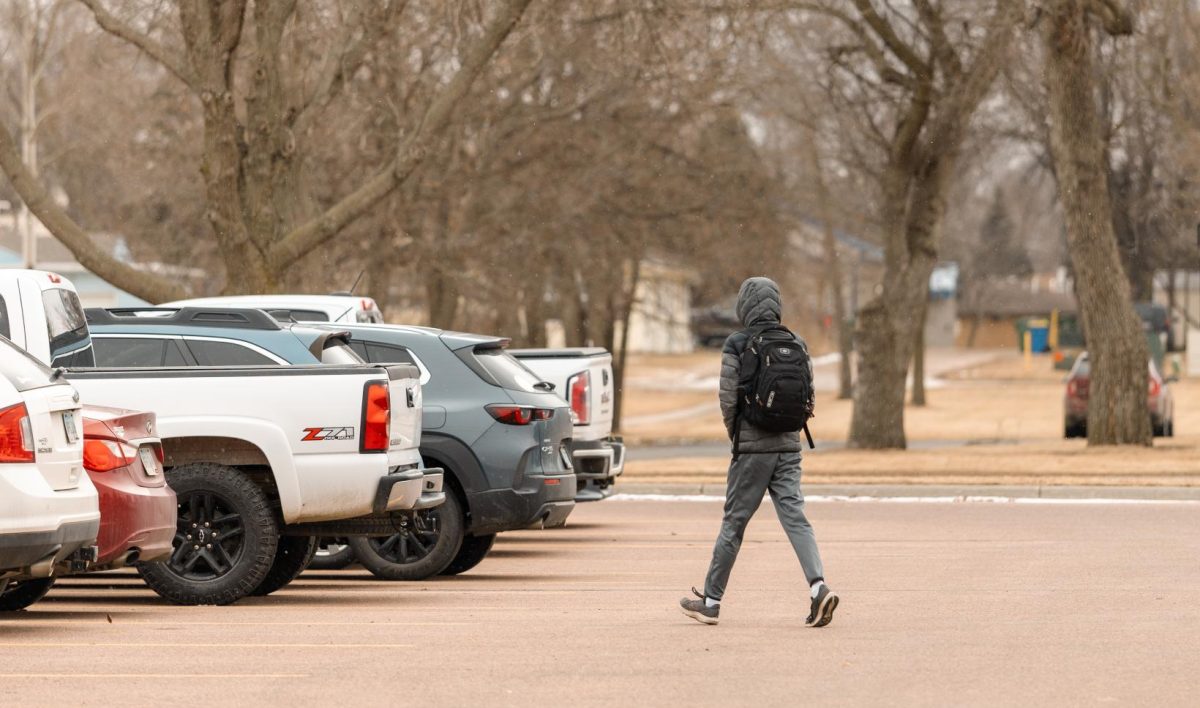 A student walks through Lot 147 on SDSU campus on Feb. 19, 2026.
