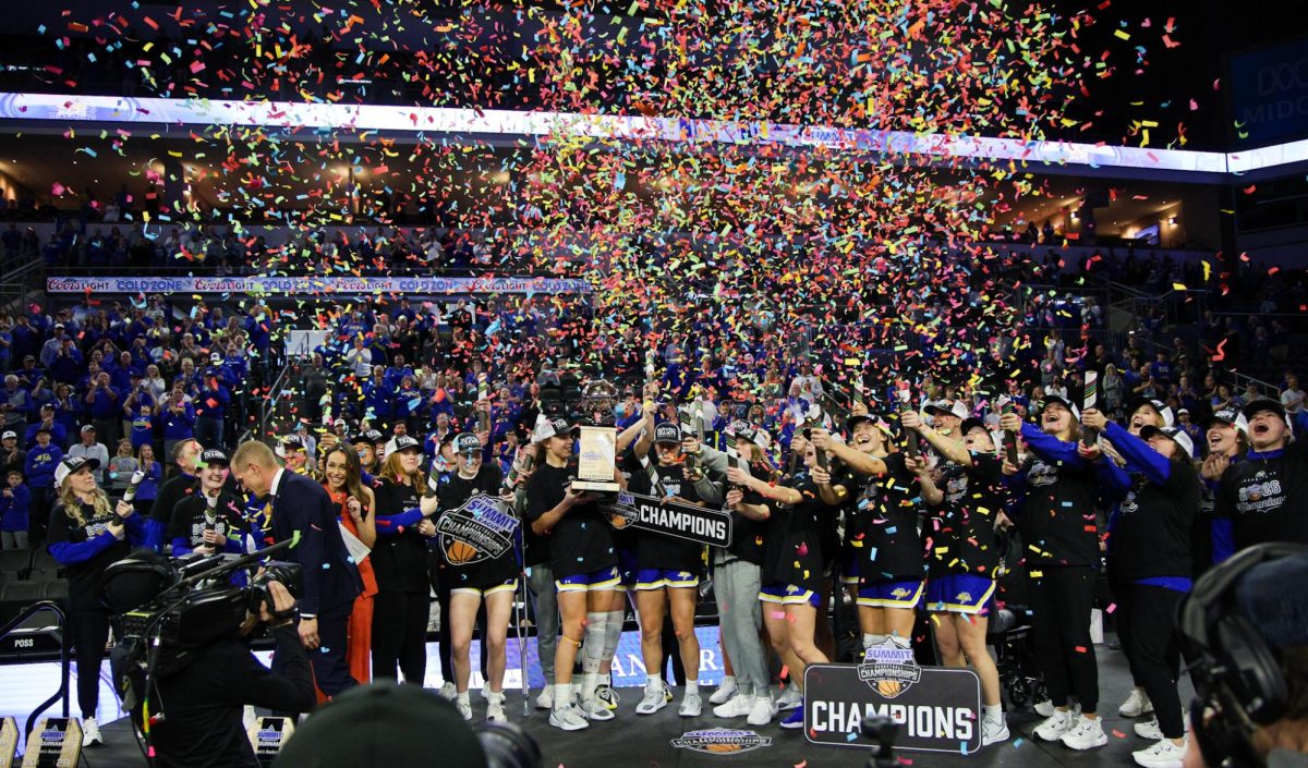 The SDSU women's basketball team celebrates after winning their fourth straight Summit League conference championship at the Denny Sanford PREMIER Center in Sioux Falls, S.D., on March 8, 2026. The Jacks played the NSDU Bison in the championship game.