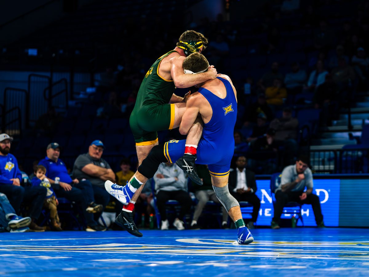 Redshirt junior wrestler Bennett Berge faces NDSU wrestler during the Border Bell on Feb. 22 at First Bank & Trust Arena. The Jacks took a tough 20-13 loss against the Bison in the final regular season dual of the season but will look to bounce back during the Big 12 championships.