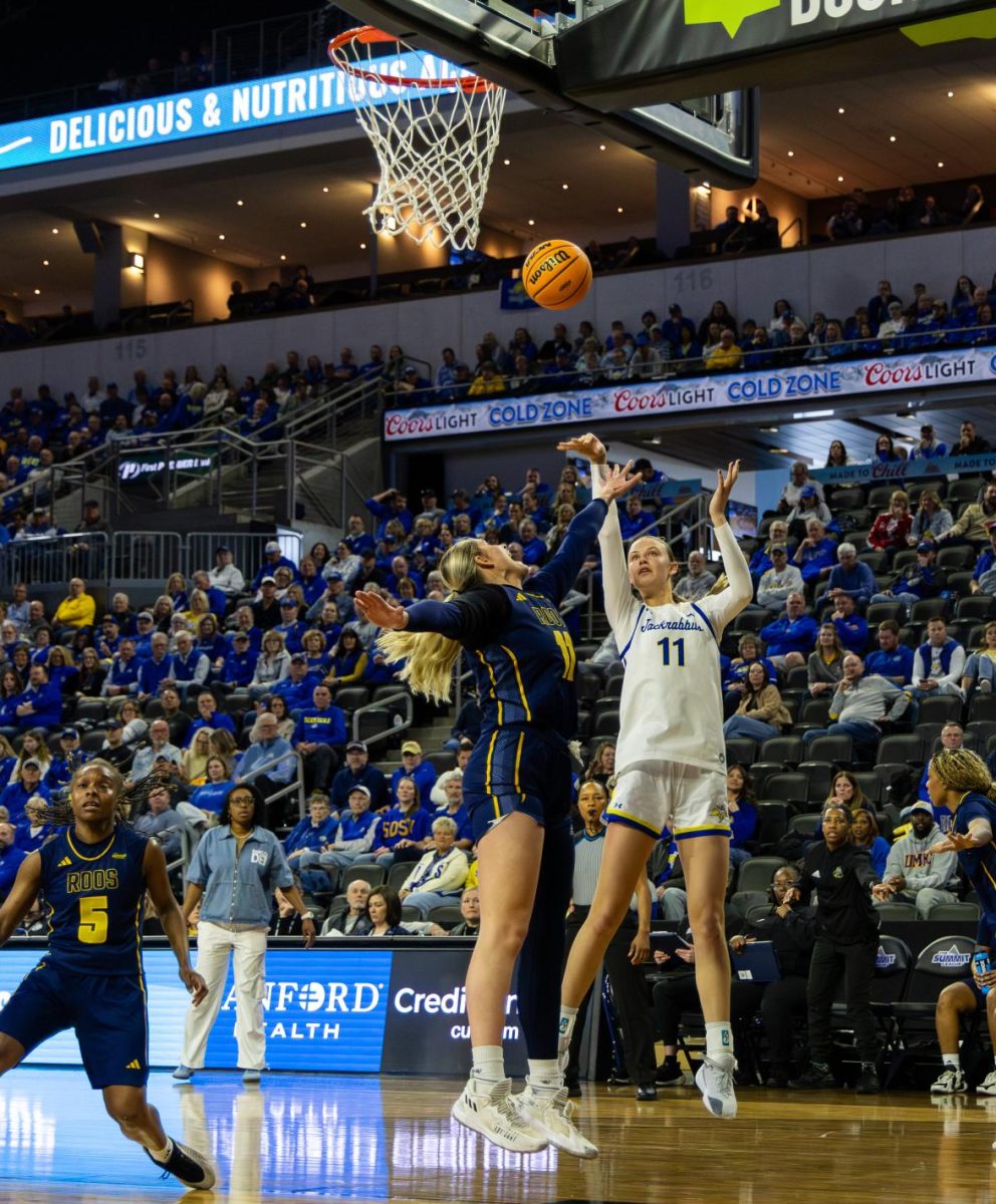 Hadley Thul shoots over a Kansas City opponent at the Summit League tournament today. The Jackrabbit women will play again Saturday against the winners of the USD versus Denver game.