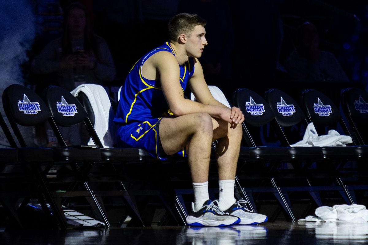 South Dakota State's Damon Wilkinson sits on a chair courtside at the Denny Sanford PREMIER Center in Sioux Falls before a Summit League Tournament game on Thursday, March 5, 2026.