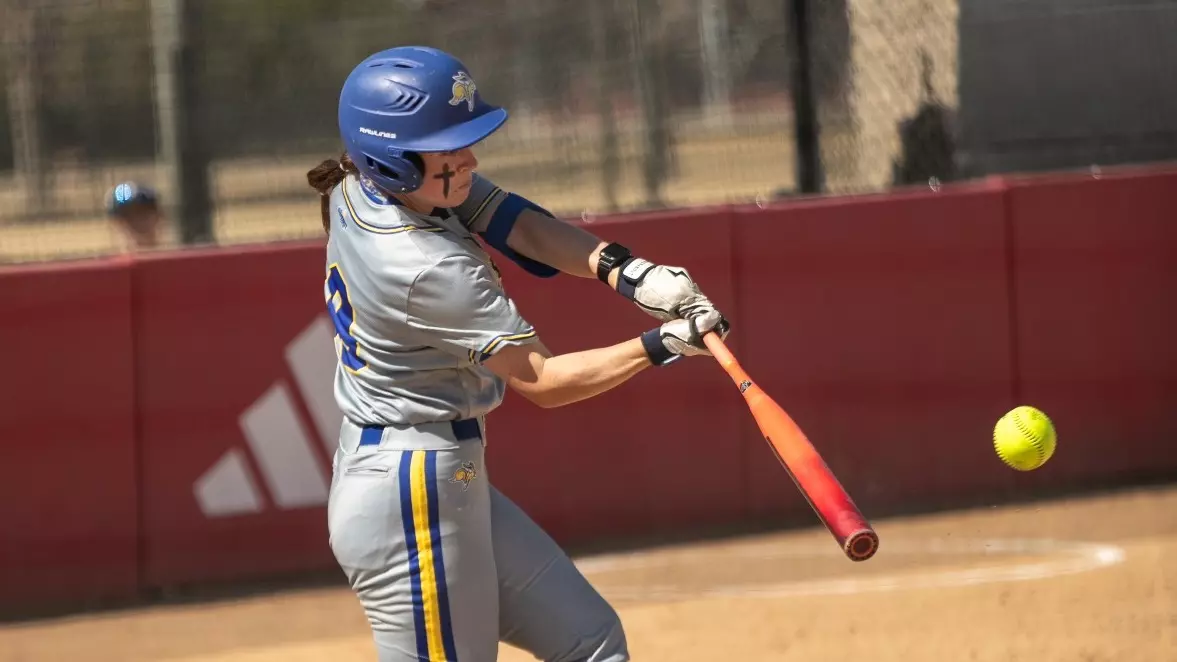 Emma Christensen swings the bat during a softball game against the University of South Dakota on March 22, 2026, in Vermillion, S.D. Christensen had two hits and a run in SDSU’s 8-6 loss. Over the course of the three game series, she had five hits and four runs.