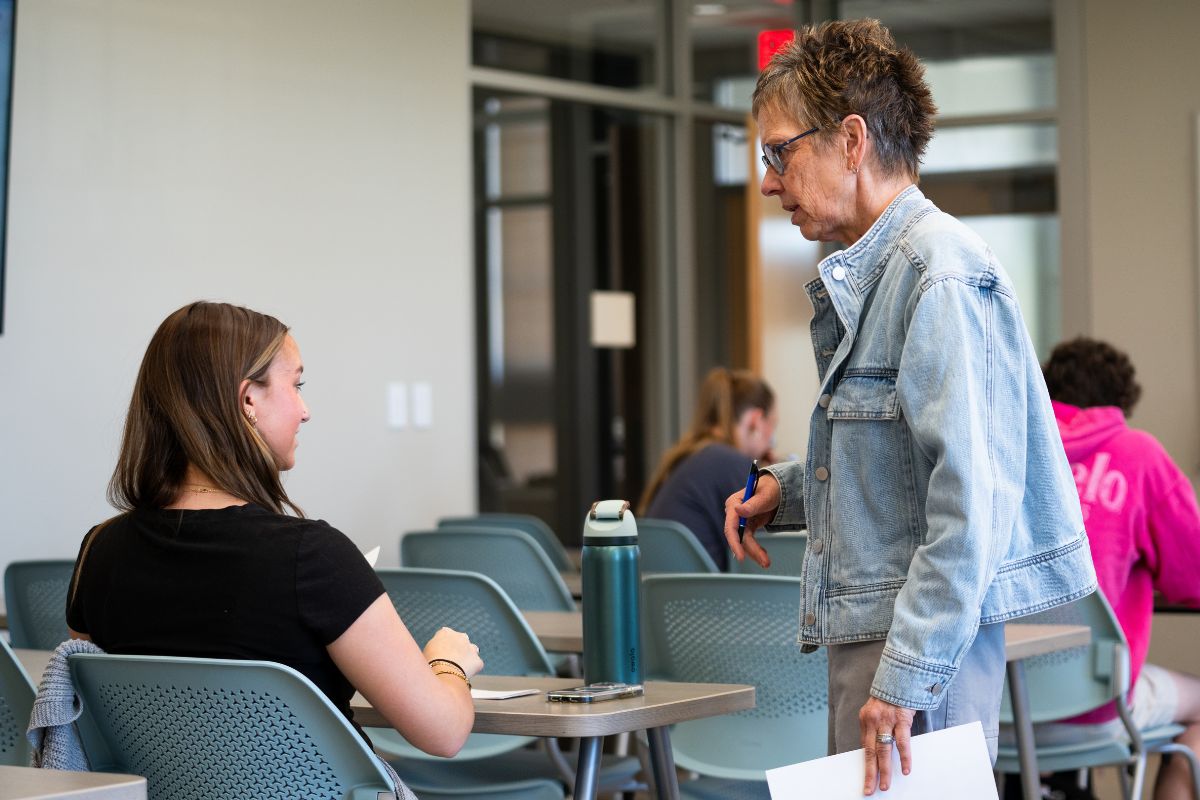 Johnson speaks to one of her students in her 'Life, Love and Money' class inside a Lincoln Hall classroom on Tuesday, April 21, 2026.