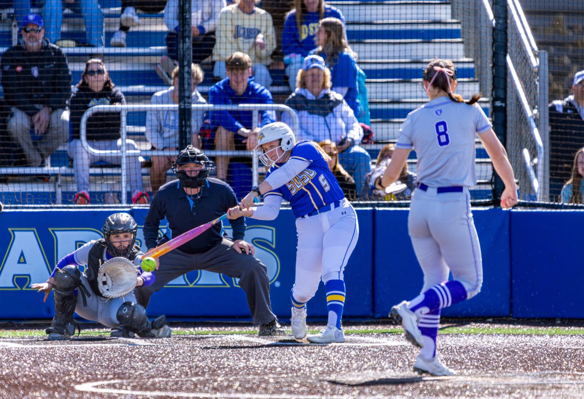 Senior Kaylee Kurdish swings at a pitch from St. Thomas pitcher Ava Kleinfeldt Friday, April 24. The Jacks took a 11-5 loss during the first game of the double-header and then took another loss later in the day to get swept 2-0 in the series
