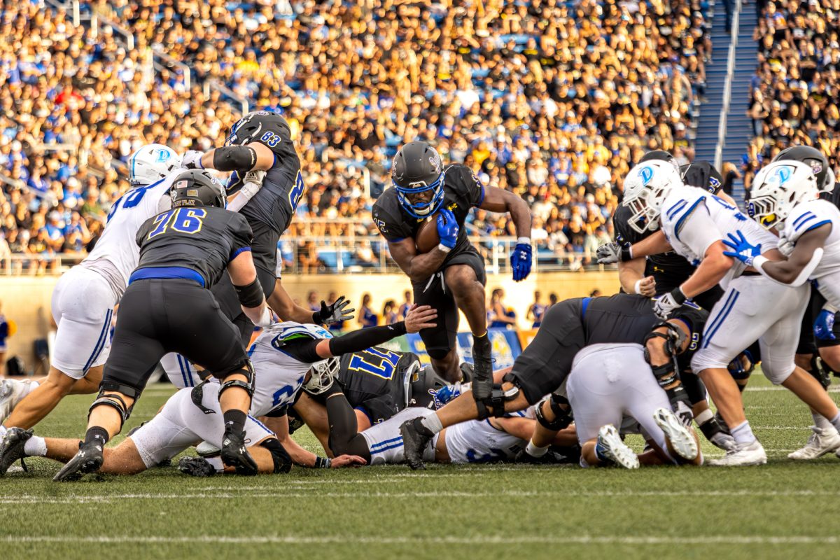 South Dakota State running back Julius Loughridge (15) jumps across the line of scrimmage during an NCAA college football game against Drake on Saturday, Sept. 13, 2025 at Dana J. Dykhouse Stadium in Brookings.