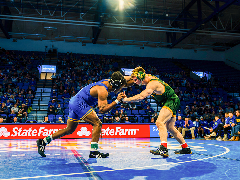 SDSU redhsirt sophomore Marcus Espinoza-Owens duals agaisnt NDSU wrestler on Sunday, Feb. 22 in First Bank & Trust Arena in Brookings, SD. Espinoza-Owens won his matchup but the Jacks fell short 13-10 against the Bison.
