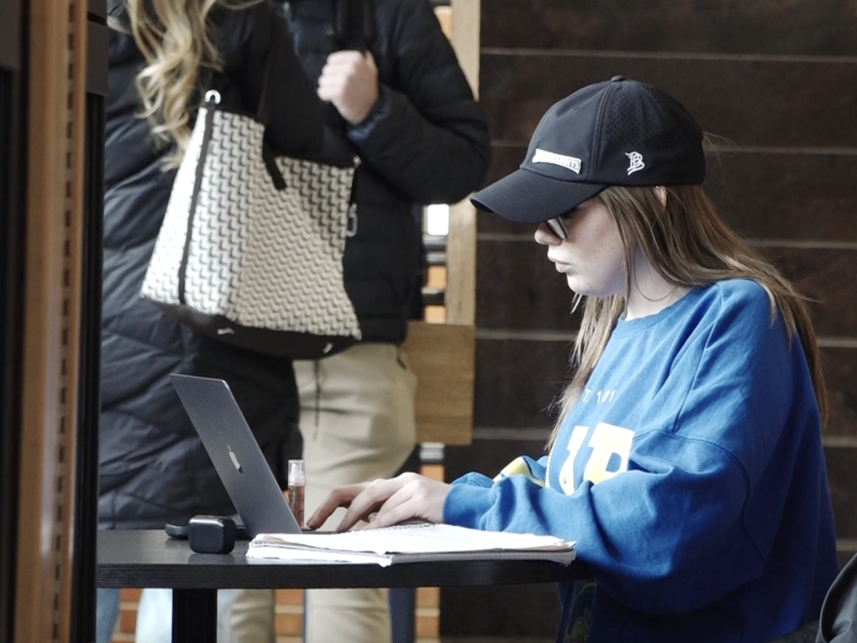 A student pictured doing work in the Student Union. Finals week for the spring semester is May 4 through 8 .